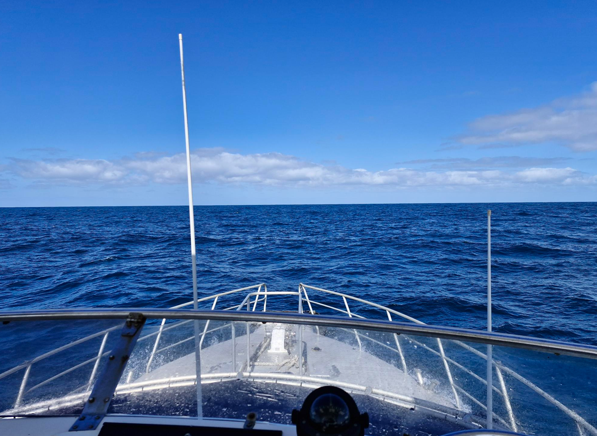 Survey vessel underway in open ocean capturing marine data, supporting offshore environmental monitoring, marine surveys and coastal data collection