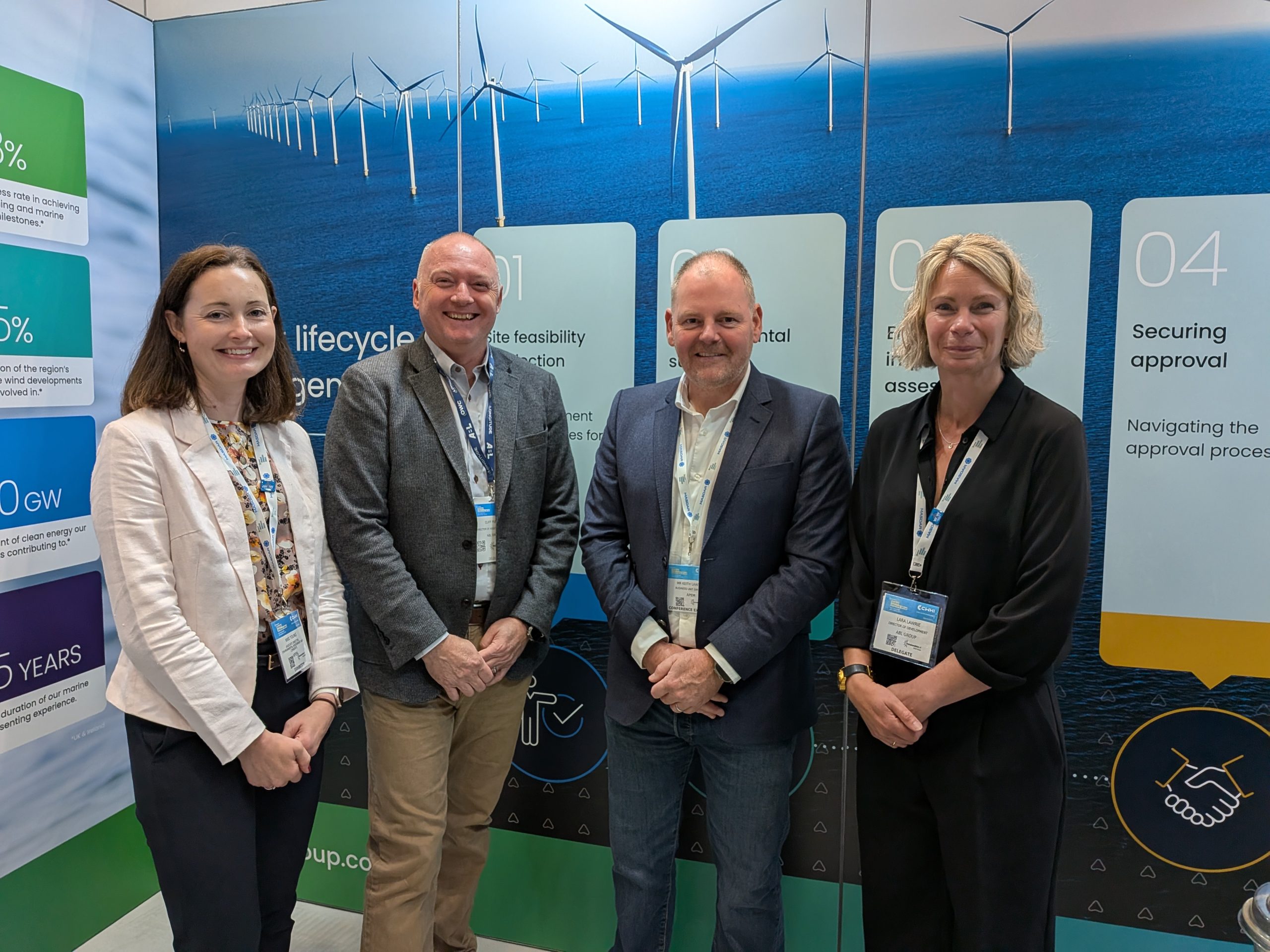 Nikki Young, Associate Director at GoBe Consultants (part of APEM Group), Cliff Pullen, Director of Asset Management at OWC, Keith Lawton, Business Unit Director at APEM Group, and Lara Lawrie, Director of Environment and Consents at OWC, at an industry event discussing offshore wind, renewable energy and environmental consultancy services.